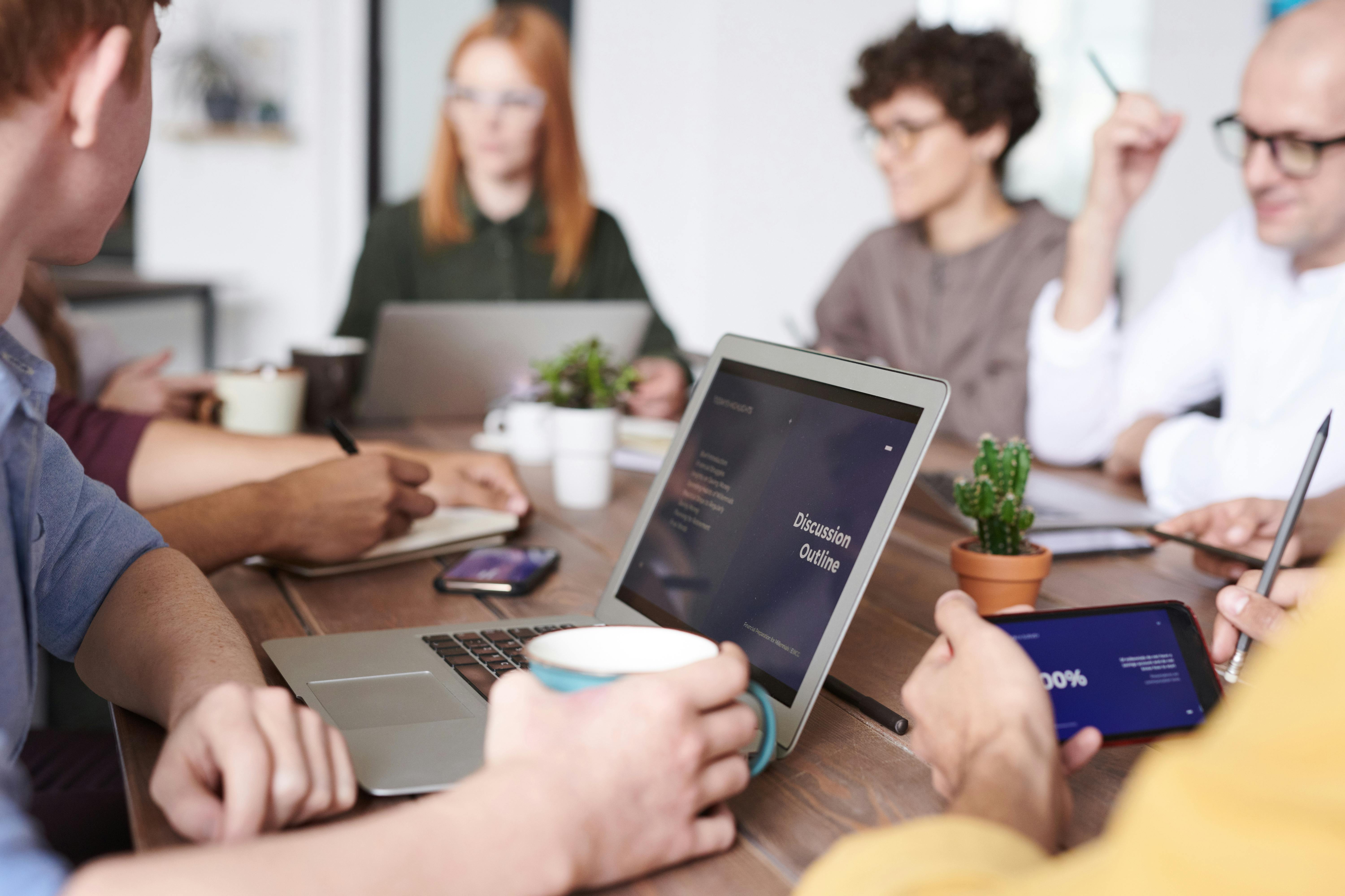 Diverse group of people feeling energized in a neon-lit room